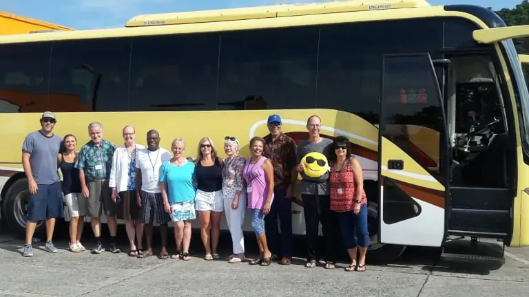 Group photo in front of tour bus